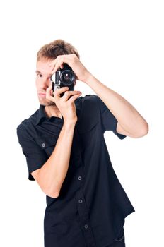 Young man with camera isolated on white background