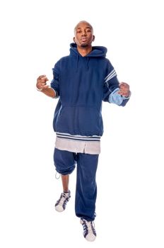 Cool young hip-hop dancer on white background