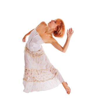 Beautiful red-haired dancer isolated on white background