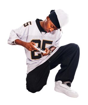 Cool hip-hop young man isolated on white playing on psp