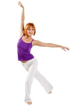 Red haired girl performing fitness exercises on white background