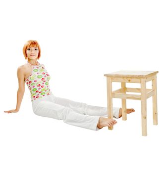 Young red-haired fitness girl isolated on white background