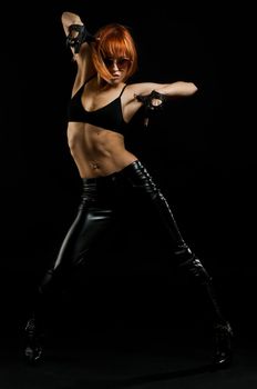 Studio shot of beautiful red girl on black background
