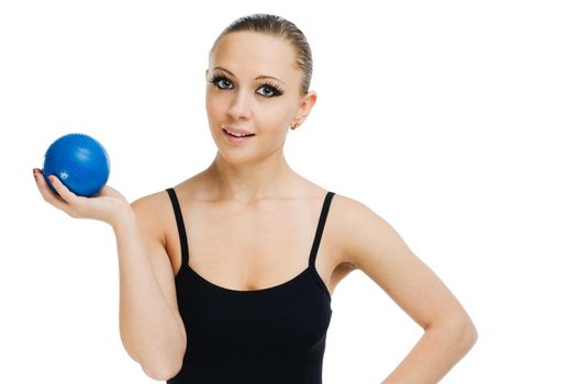 Beautiful fit red girl working out with blue ball