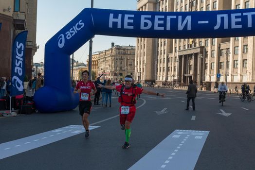 Moscow - September 24, 2017: Participants of Moscow autumn marathon sponsored by Asics brand