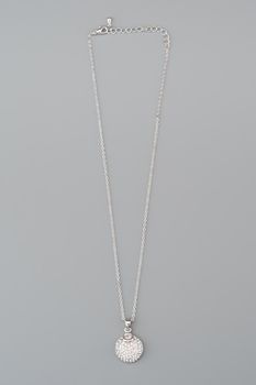 Silver necklace with pendant shot on gray background