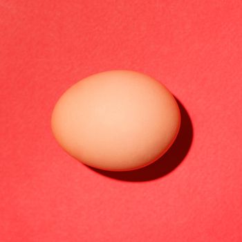 Top view of traditional red easter eggs on red background. 