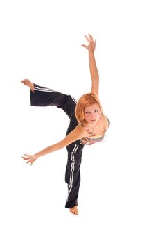 Red haired girl performing fitness exercises on white background