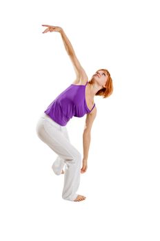 Red haired girl performing fitness exercises on white background