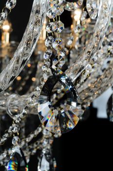 Contemporary glass chandelier isolated over black background