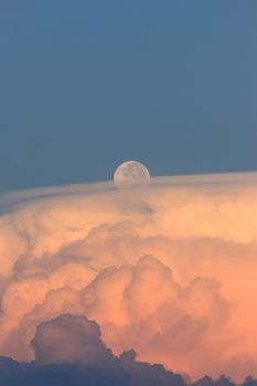 Set of pictures, evening clouds and the moon rising before the night
