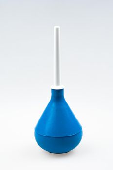 Enema (clyster) on white background with soft shadow