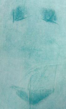 Shot from above at beach towel with traces of wet bikini on it