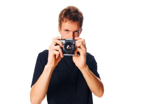 Young man with camera isolated on white background