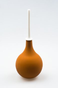 Enema (clyster) on white background with soft shadow