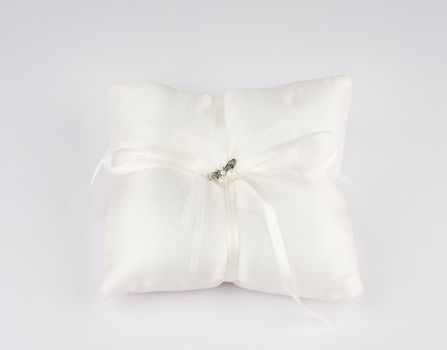 Exquisite pillow for wedding rings on gray background