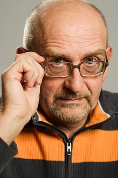 Handsome mature man posing on plain background