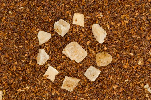 Background of chineese tea leaves with bits of dried pineapple