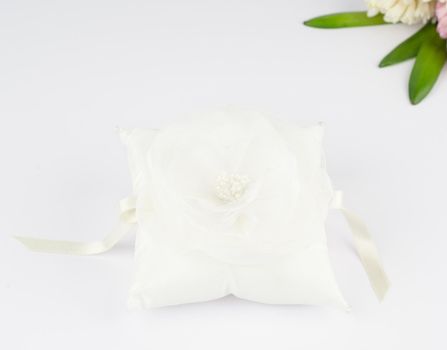 Exquisite pillow for wedding rings on gray background