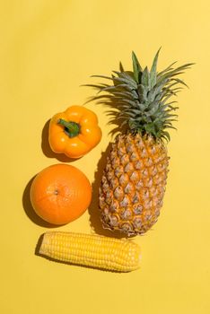 Assortment of exotic fruits isolated on yellow