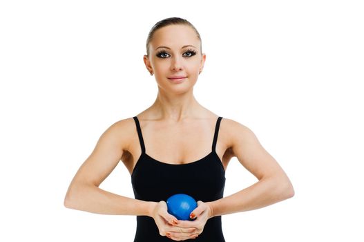 Beautiful fit red girl working out with blue ball