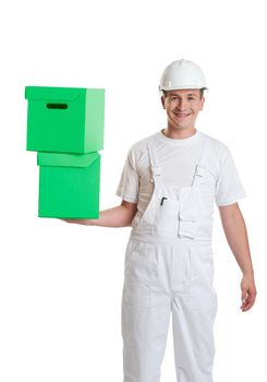 Happy worker smiling holding two green cardboard boxes in hand