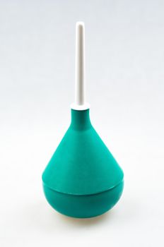 Enema (clyster) on white background with soft shadow