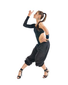 Beautiful modern dancer wearing high heels on white