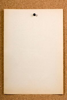 Page of old run-down paper attached to the bulletin board