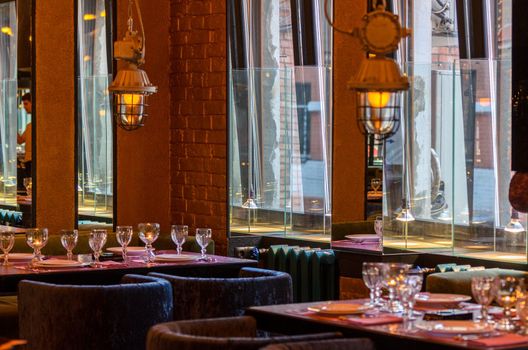 Moscow - Circa 2011: Restaurant interior with large mirror near window