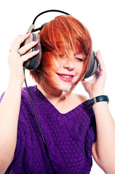 Red-haired girl listening to the music