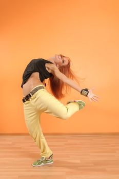 Modern dancer poses in front of the vivid background
