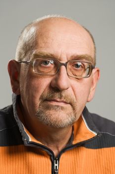 Handsome mature man posing on plain background