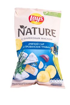 Tyumen, Russia-May 25, 2021: Lays chips nature with cheese and provencal herbs. On white background