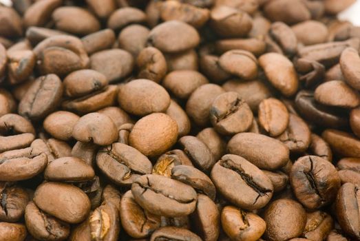 Pile of roasted coffee beans with white background