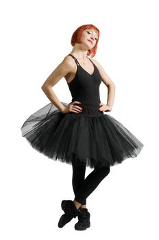 Beautiful red-haired ballerina wearing tutu on white background