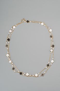 Beautiful fashion jewellery necklace bracelet on gray background