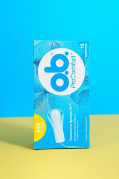 Tyumen, Russia-april 17, 2021: OB is brand of feminine hygiene products or personal care products used by women during menstruation. blue yellow background