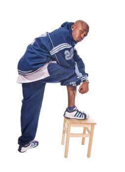 Cool young hip-hop dancer on white background