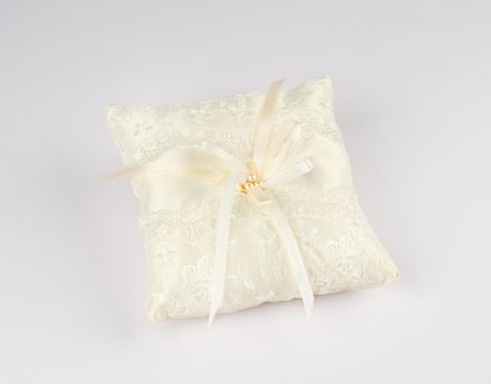 Exquisite pillow for wedding rings on gray background