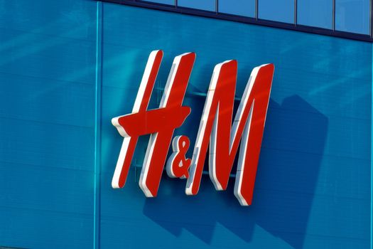 Tyumen, Russia-August 01, 2021: Close up shot of H and M storefront. Fast fashion clothing
