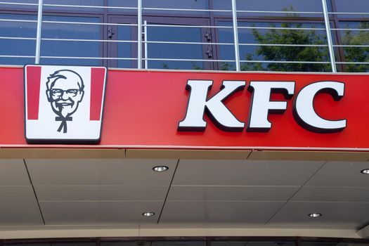 Tyumen, Russia-May 16, 2021: KFC logo fast food restaurant chain specializing in chicken dishes