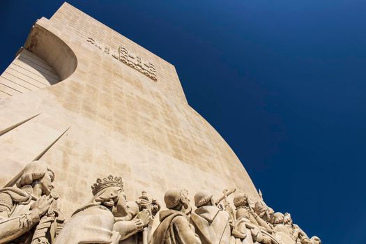 Colossal Discovery Monument in a sunny day next to Tagus River at sunset in Lisbon