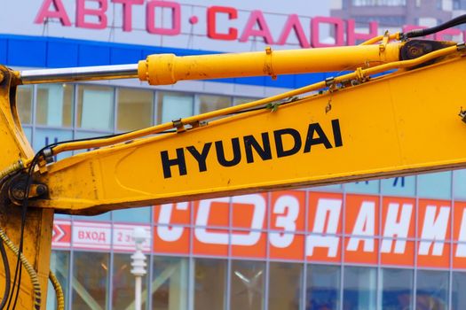 Tyumen, Russia-August 09, 2021: Hyundai logo Crawler Excavator working in city