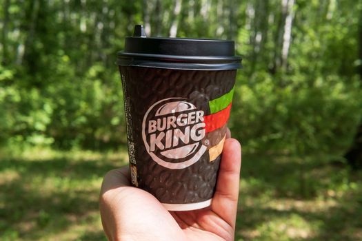 Tyumen, Russia-May 25, 2021: Burger Kings coffee cup. American Fast Food Restaurant. Logo