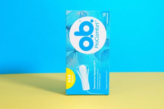 Tyumen, Russia-april 17, 2021: O.B. tampons, a global brand of feminine hygiene products or personal. Yellow blue background