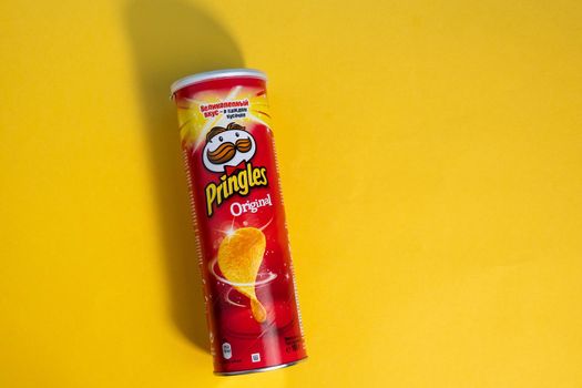 Tyumen, Russia-June 21, 2021: Pringles chips are original. Owned by the Kellogg Company, Pringles is a brand of potato sack chips