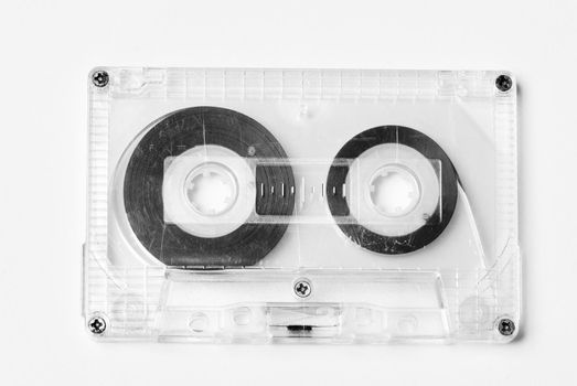Old plastic audio cassette isolated on white