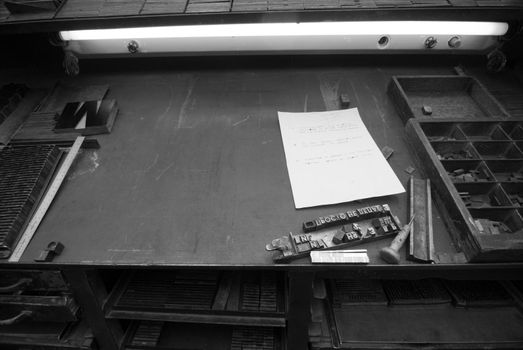 Font assembler's table at a printing works office