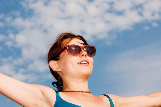 Young girl with outstretched arms at the beach